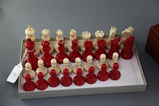 An early 20th century Staunton pattern carved and stained ivory chess set, kings 4in.